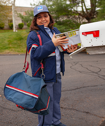 Postal Uniform Postal Carrier Delivering Mail